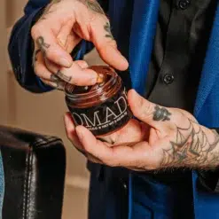18.21 Man Made Sweet Tobacco Pomade - Medium Hold High Shine Men's Hair Styling Pomade - Man Holding Jar