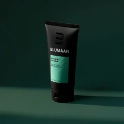 Blumaan Volume Cream - Mens Hair Styling Product - Image On Green Background
